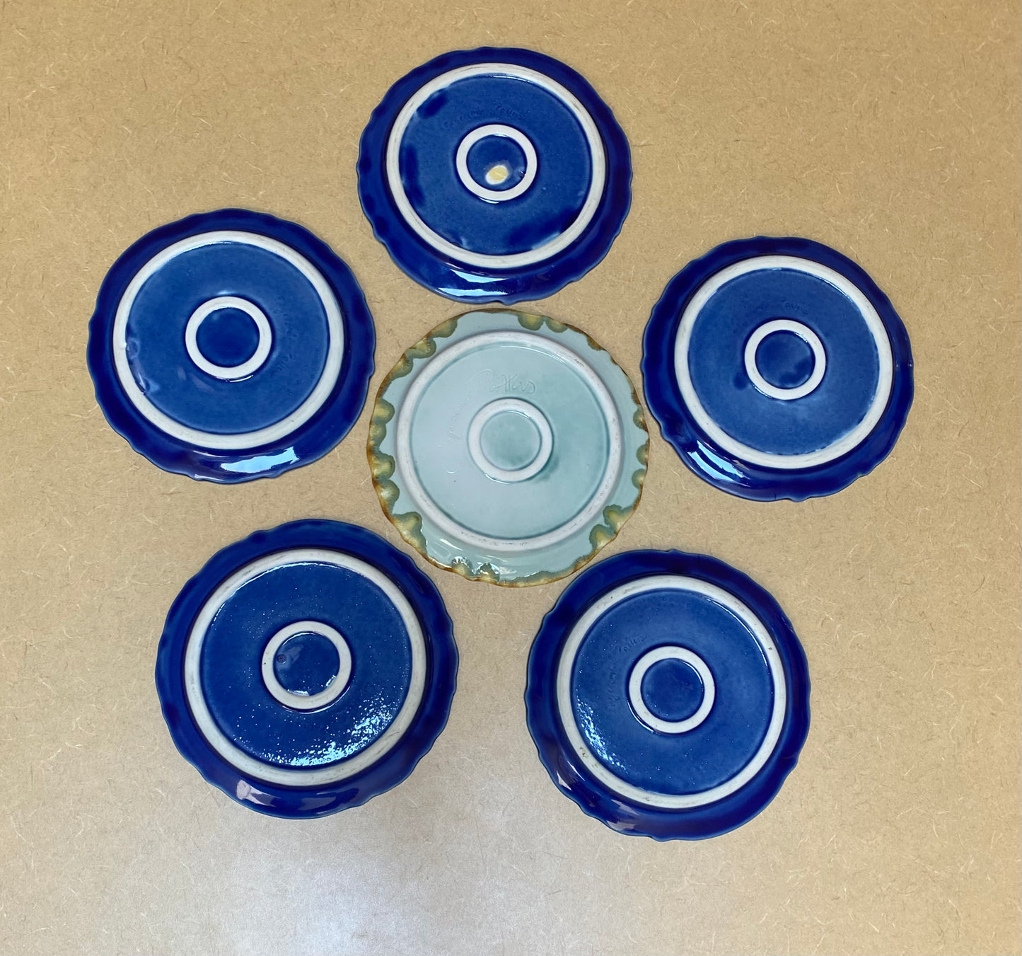 Six 8-inch Edgecomb pattern salt glaze plates